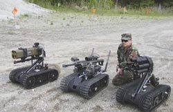 Staff Sgt. Santiago Tordillos demos armed Talon robots during live fire testing at Picatinny. Photo by Stephen Trentanelli